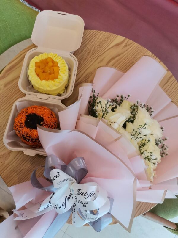 bento mango supreme cake with choco butternut cake and a flower bouquet