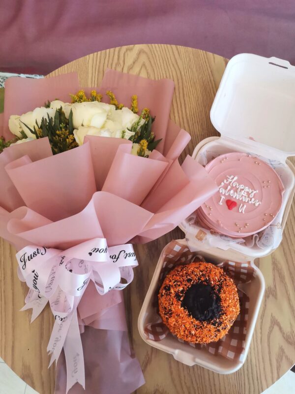 happy valentine's cake with choco butternut and a flower bouquet